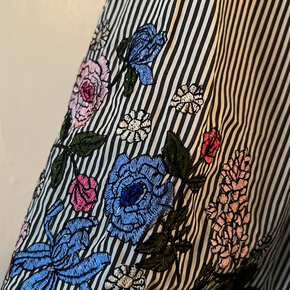 Liz Claiborne black and white striped top with colorful flower embroidery.